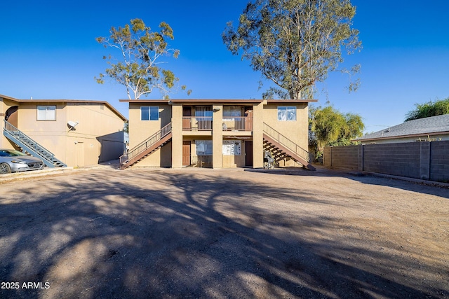 rear view of property with a balcony