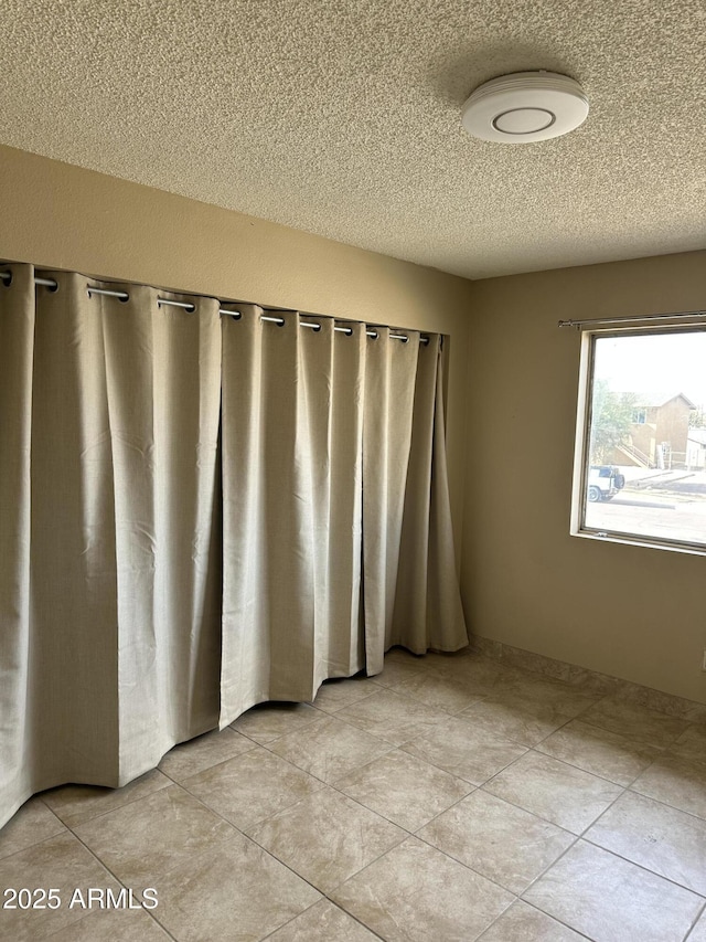 view of tiled spare room