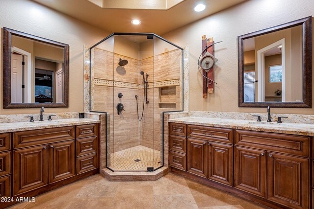 bathroom with vanity and a shower with shower door