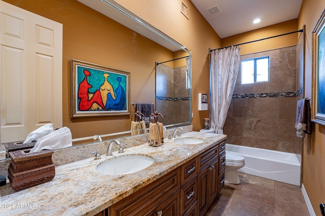 full bathroom featuring tile patterned flooring, vanity, toilet, and shower / bath combination with curtain