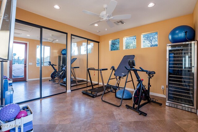 exercise area with ceiling fan and wine cooler