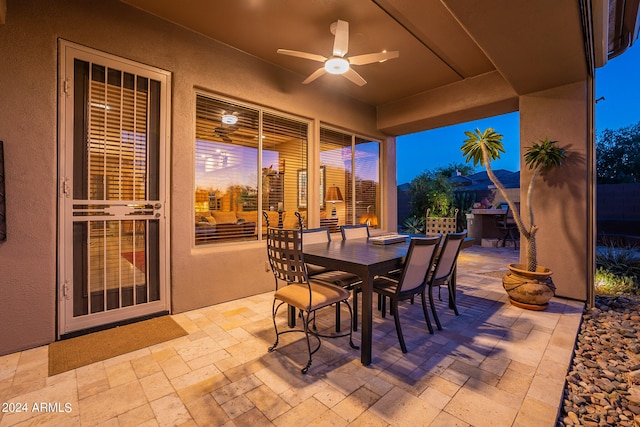 patio terrace at dusk with ceiling fan