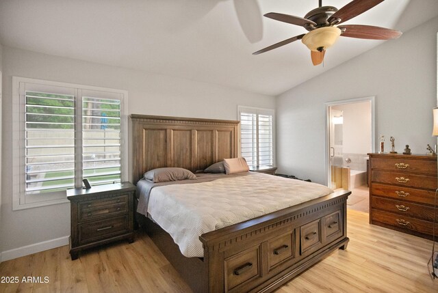 21335 N 64th Ave, Glendale, AZ 85308 - bedroom featuring light wood-style flooring, baseboards, vaulted ceiling, and connected bathroom