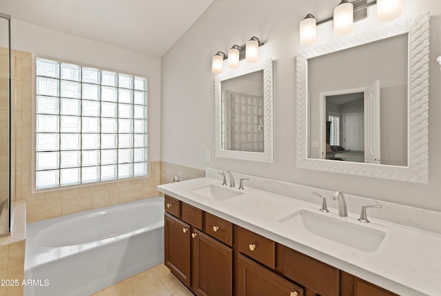 21335 N 64th Ave, Glendale, AZ 85308 - full bath with tile patterned floors, double vanity, a bath, and a sink