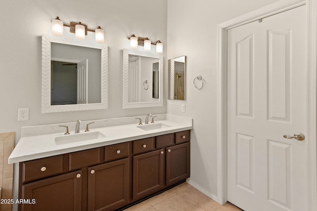 21335 N 64th Ave, Glendale, AZ 85308 - full bathroom featuring tile patterned floors, double vanity, a sink, and baseboards