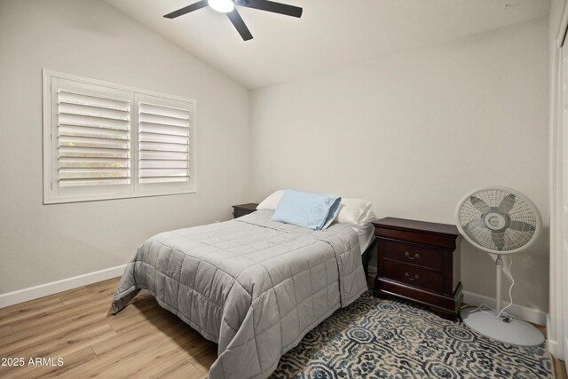 21335 N 64th Ave, Glendale, AZ 85308 - bedroom featuring wood finished floors, baseboards, a ceiling fan, and lofted ceiling