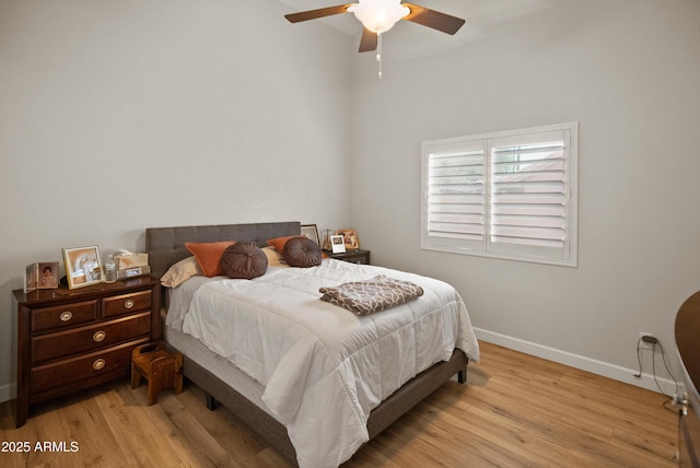 21335 N 64th Ave, Glendale, AZ 85308 - bedroom with baseboards, light wood finished floors, and a ceiling fan