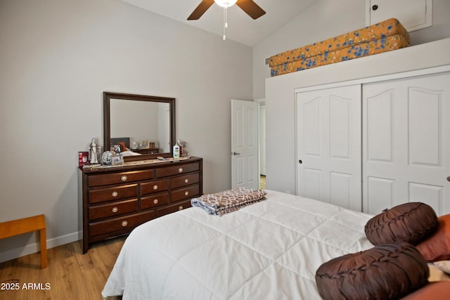 21335 N 64th Ave, Glendale, AZ 85308 - bedroom with a closet, baseboards, light wood-type flooring, a ceiling fan, and high vaulted ceiling
