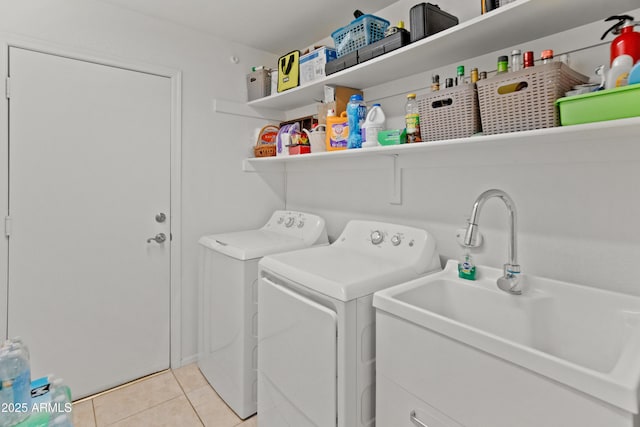 21335 N 64th Ave, Glendale, AZ 85308 - laundry area with light tile patterned floors, washing machine and dryer, laundry area, and a sink