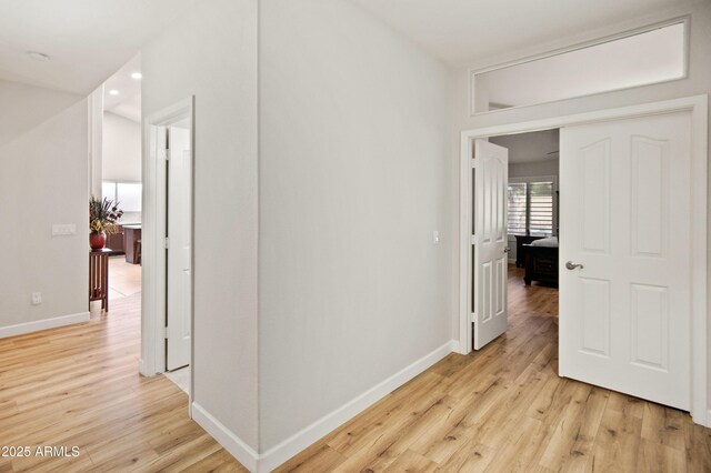 21335 N 64th Ave, Glendale, AZ 85308 - hallway with light wood-style floors and baseboards