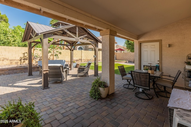 21335 N 64th Ave, Glendale, AZ 85308 - view of patio with a fenced backyard, a gazebo, outdoor dining area, and an outdoor hangout area
