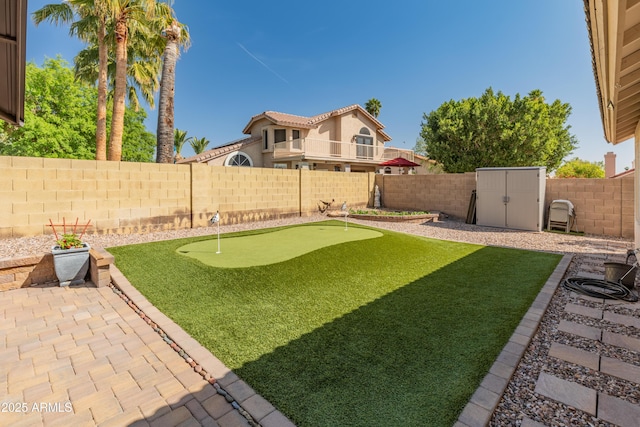 21335 N 64th Ave, Glendale, AZ 85308 - view of yard with a fenced backyard, an outdoor structure, a patio, and a shed