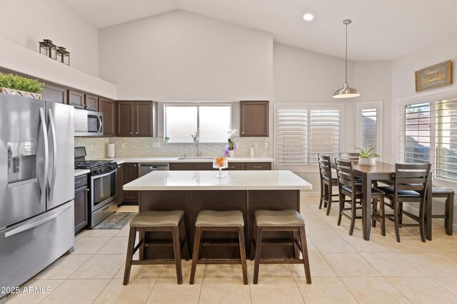 21335 N 64th Ave, Glendale, AZ 85308 - kitchen featuring a sink, light countertops, appliances with stainless steel finishes, and dark brown cabinetry