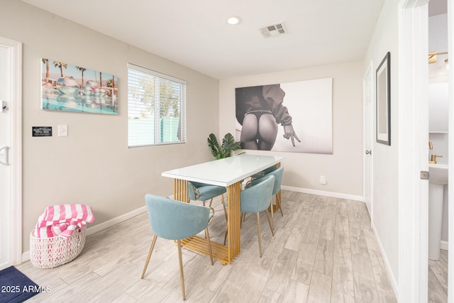 dining area featuring light hardwood / wood-style flooring