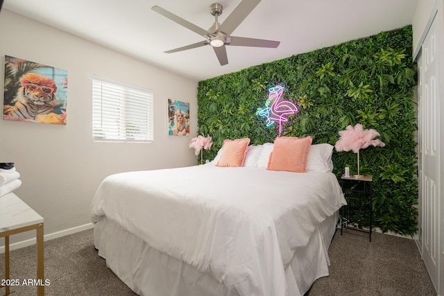 bedroom featuring ceiling fan and carpet