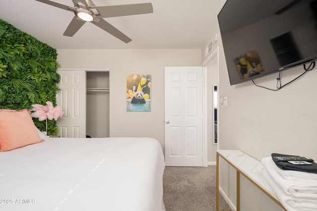 bedroom featuring ceiling fan, a closet, and light carpet