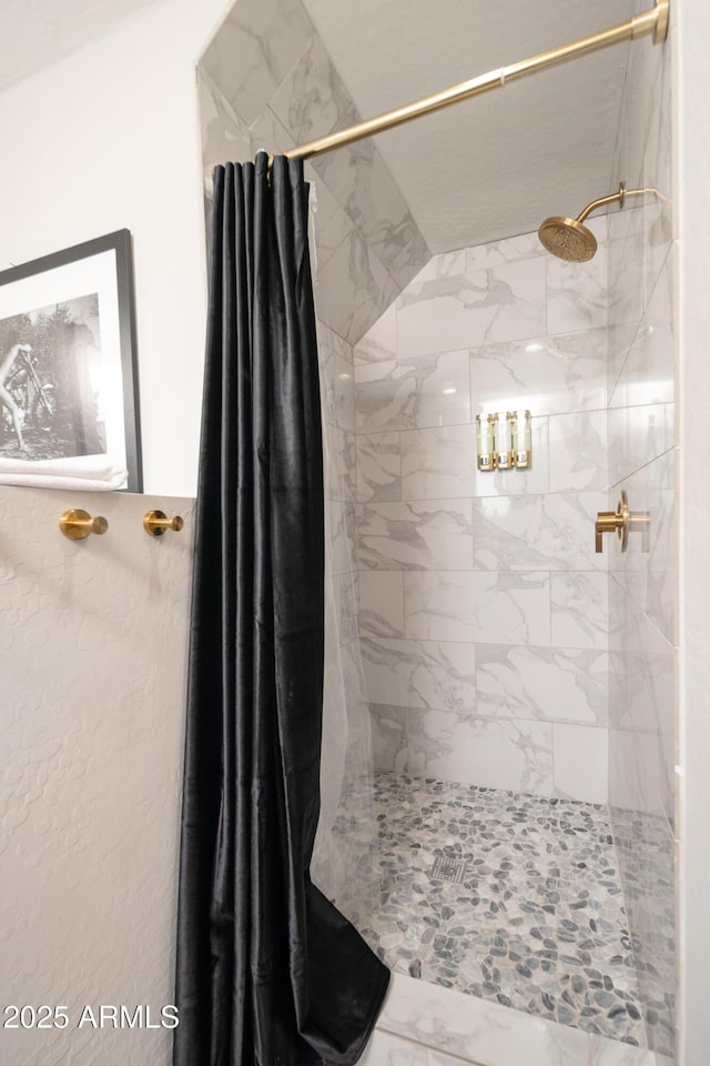 bathroom featuring a shower with curtain