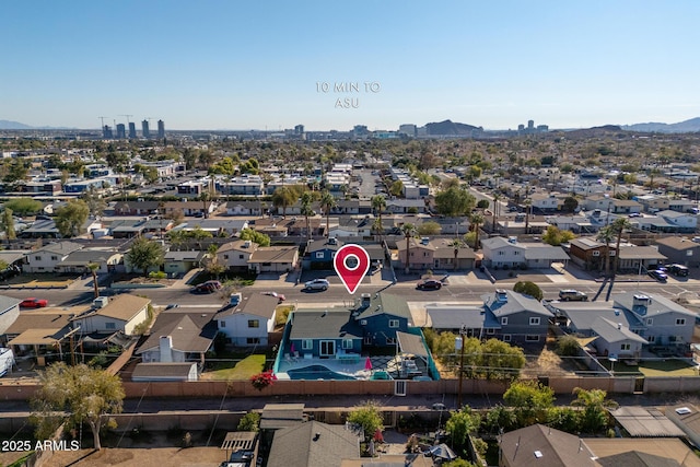 birds eye view of property with a mountain view