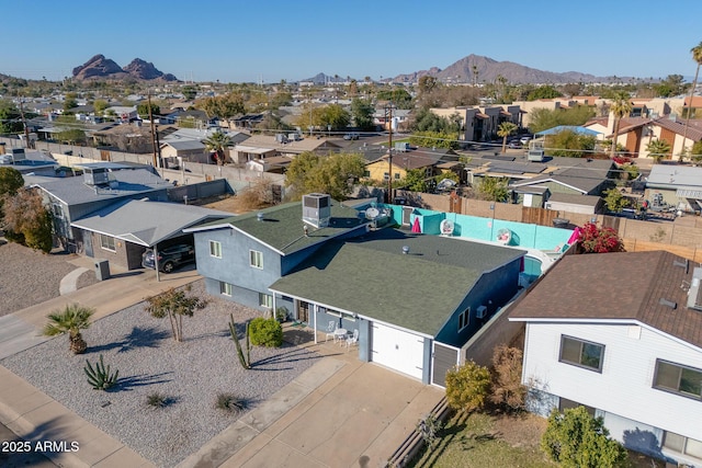 birds eye view of property with a mountain view