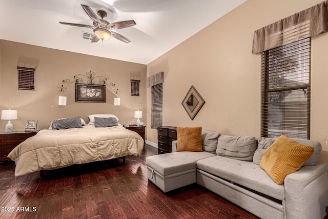 bedroom with dark wood-type flooring and ceiling fan