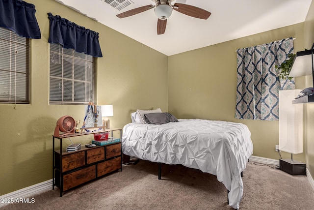 bedroom with ceiling fan and carpet flooring