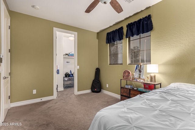 bedroom featuring ceiling fan and light colored carpet