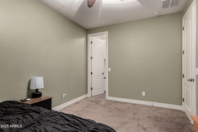 bedroom featuring light carpet and ceiling fan