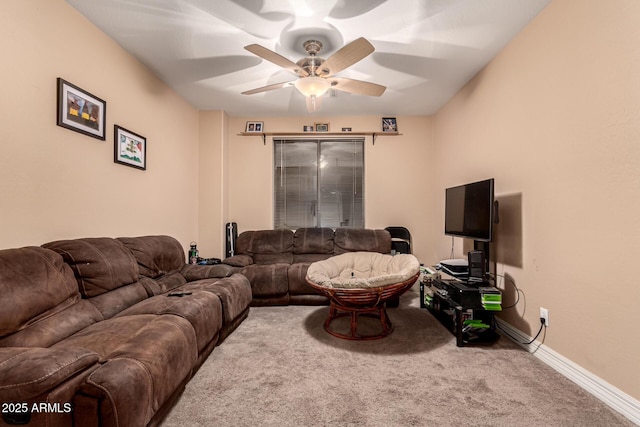 living room featuring ceiling fan and carpet