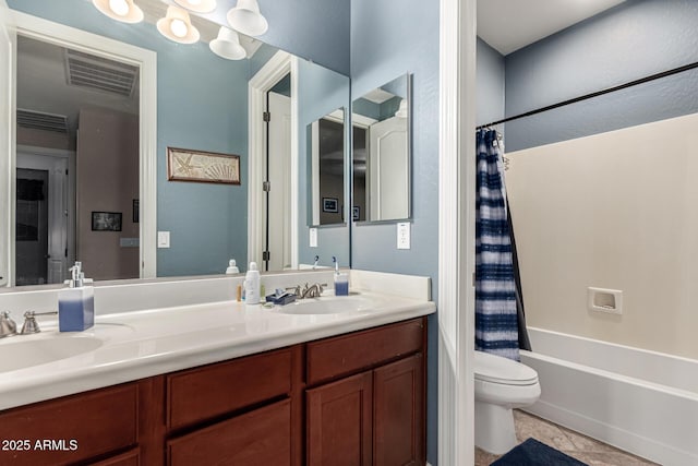 full bathroom featuring tile patterned floors, toilet, vanity, and shower / tub combo