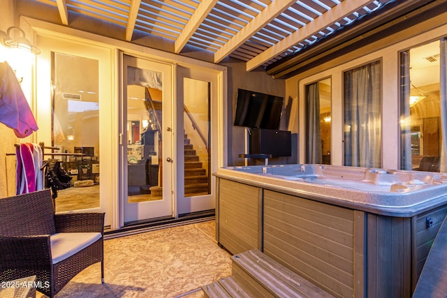 deck featuring a pergola and a hot tub