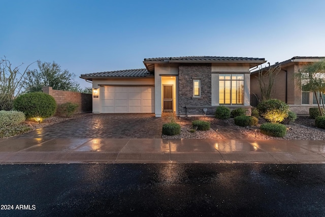 view of front of property with a garage