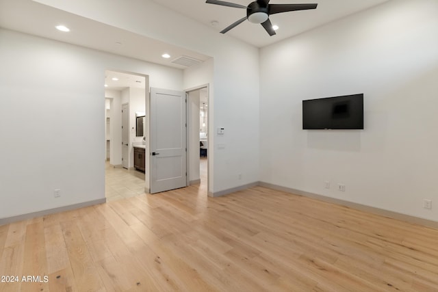 unfurnished living room with ceiling fan and light hardwood / wood-style flooring