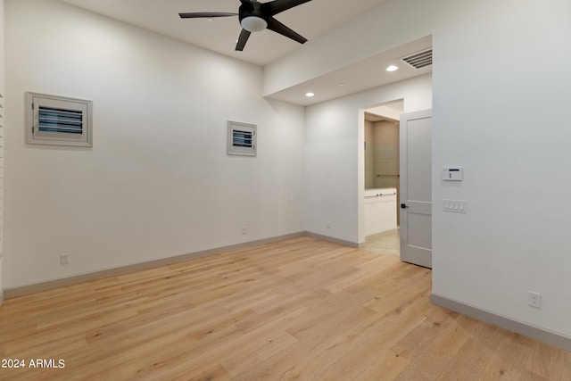 unfurnished room with ceiling fan and light hardwood / wood-style flooring