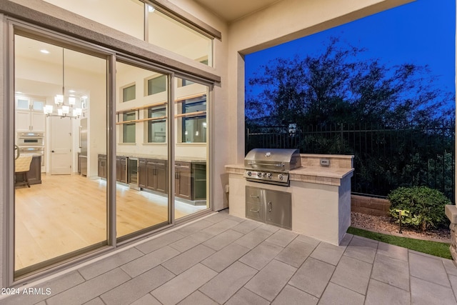 view of patio featuring grilling area and exterior kitchen