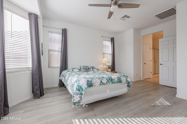 bedroom featuring light hardwood / wood-style floors and ceiling fan