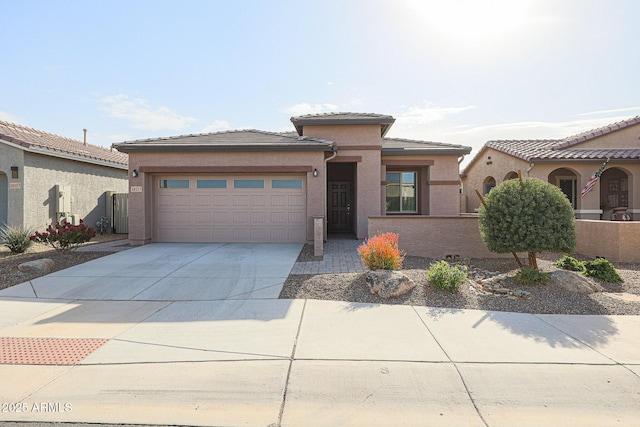 view of front of property with a garage