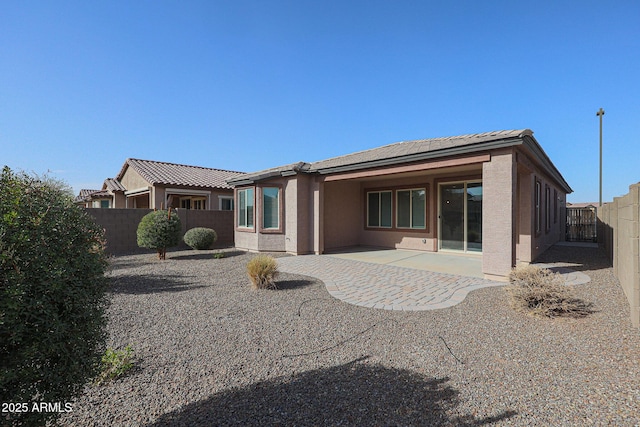 rear view of house featuring a patio area