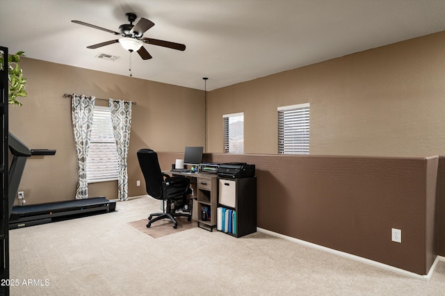 home office featuring ceiling fan and light colored carpet