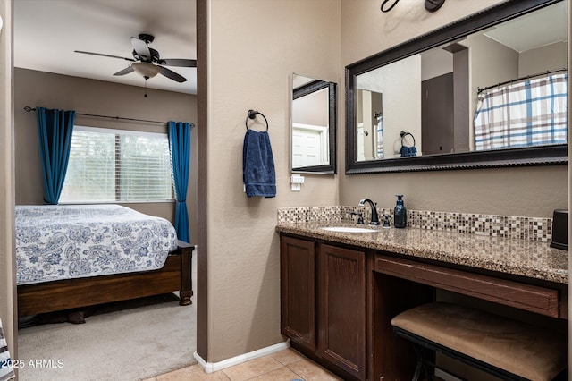 bathroom featuring ceiling fan, tile patterned floors, and vanity