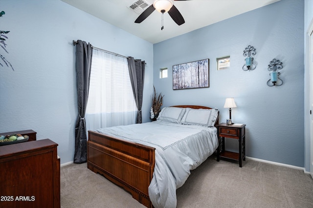 bedroom featuring ceiling fan and light colored carpet