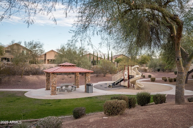 view of property's community featuring a playground and a gazebo