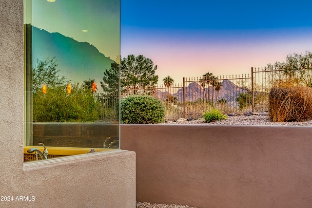 balcony at dusk with a mountain view