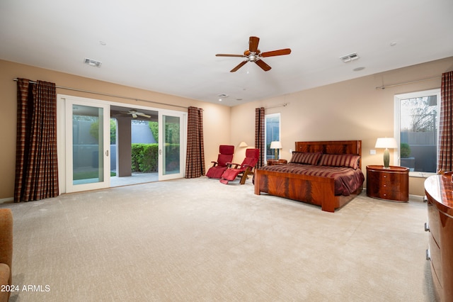 carpeted bedroom featuring access to outside and ceiling fan