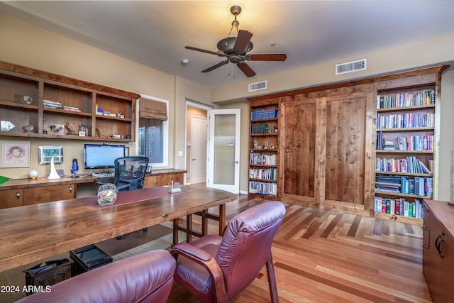 home office with french doors and ceiling fan