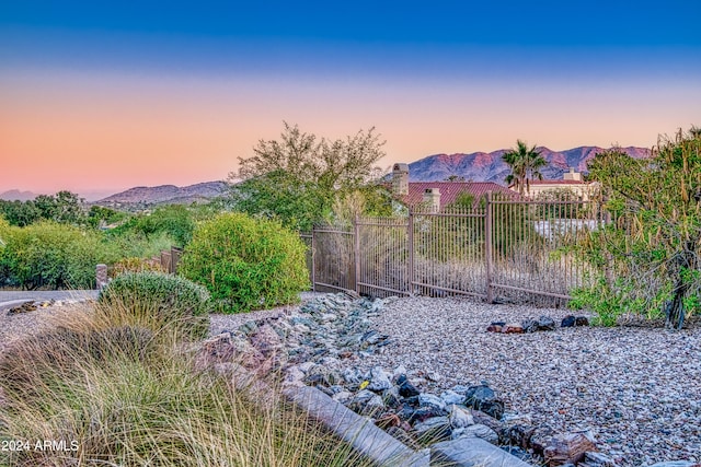 yard at dusk with a mountain view