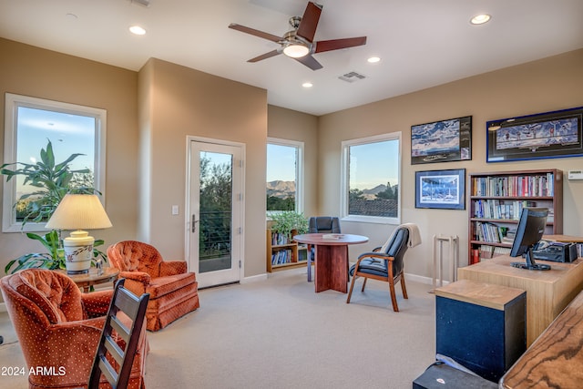 office featuring ceiling fan and light colored carpet