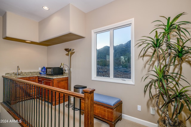 interior space featuring a mountain view and sink