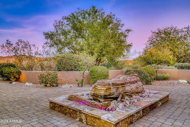 view of patio terrace at dusk