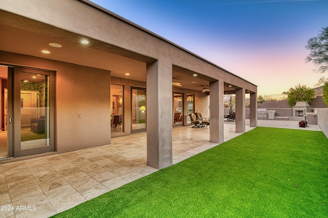 exterior space featuring ceiling fan, area for grilling, and a patio area