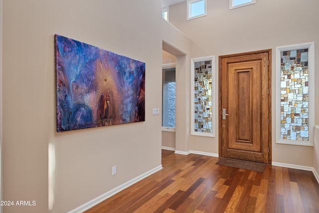 entryway with dark hardwood / wood-style floors